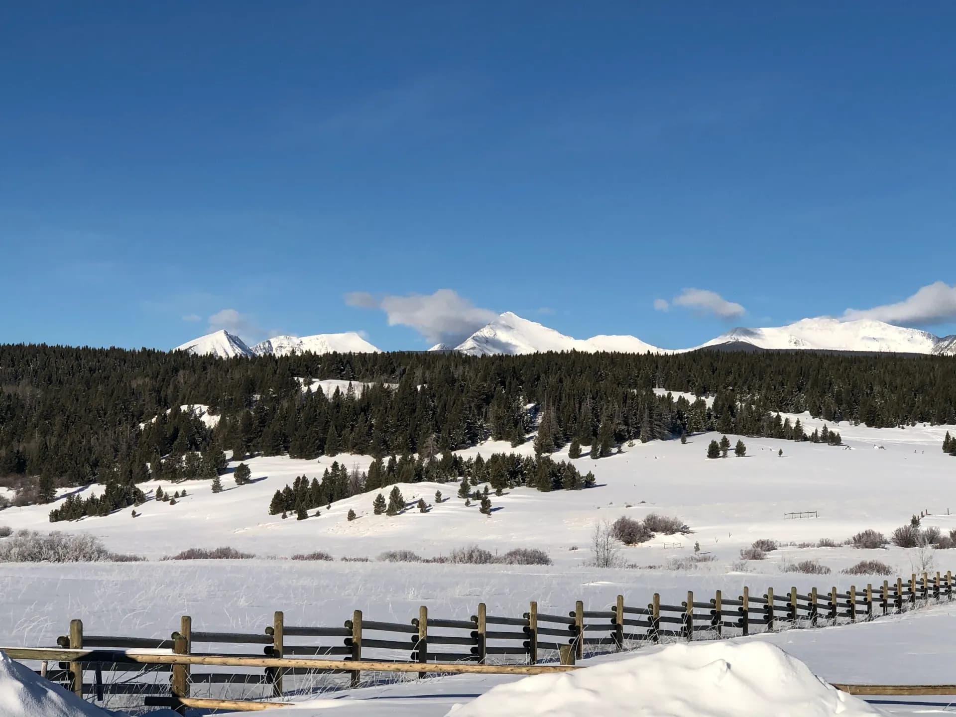 Snowy mountain range above a Montana ranch in winter