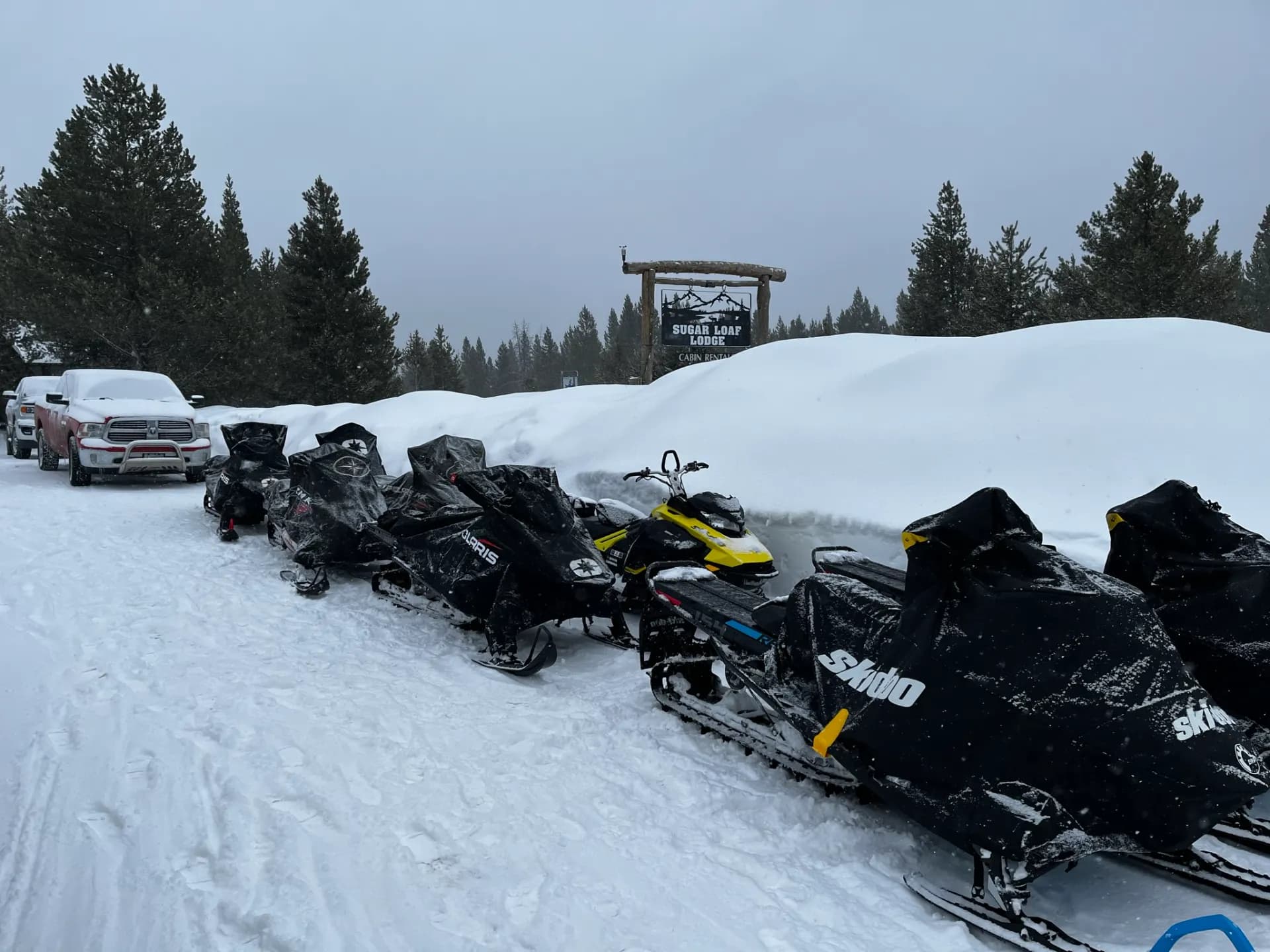 Snowmobiles parked at Sugar Loaf Lodge in winter